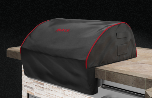 Bull 38-inch Premium Grill Head Cover installed over a Bull Brahma built-in grill featuring black finish, red piping, and stitched Bull logo.