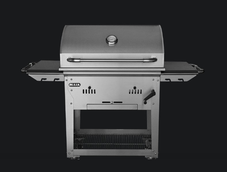 Bull Bison Premium Complete Cart charcoal grill shown closed, highlighting its 304 stainless steel body, heavy-duty thermometer, and freestanding complete cart design.
