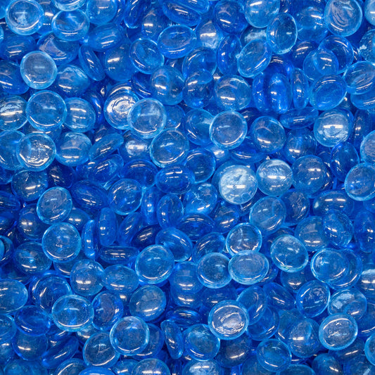 Cerulean blue pebbles 25 pond bag glow like liquid sapphire under flame