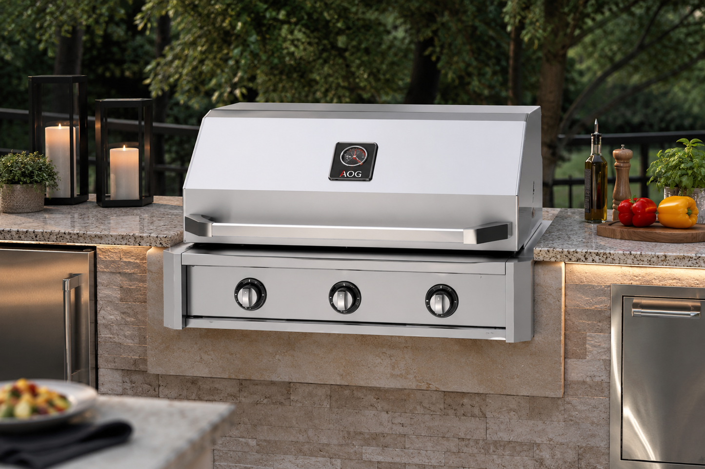 AOG 36-inch T-Series built-in propane gas grill installed in a luxury stone outdoor kitchen island with granite countertops, stainless steel access doors, ambient evening lighting, and premium backyard entertaining setting.