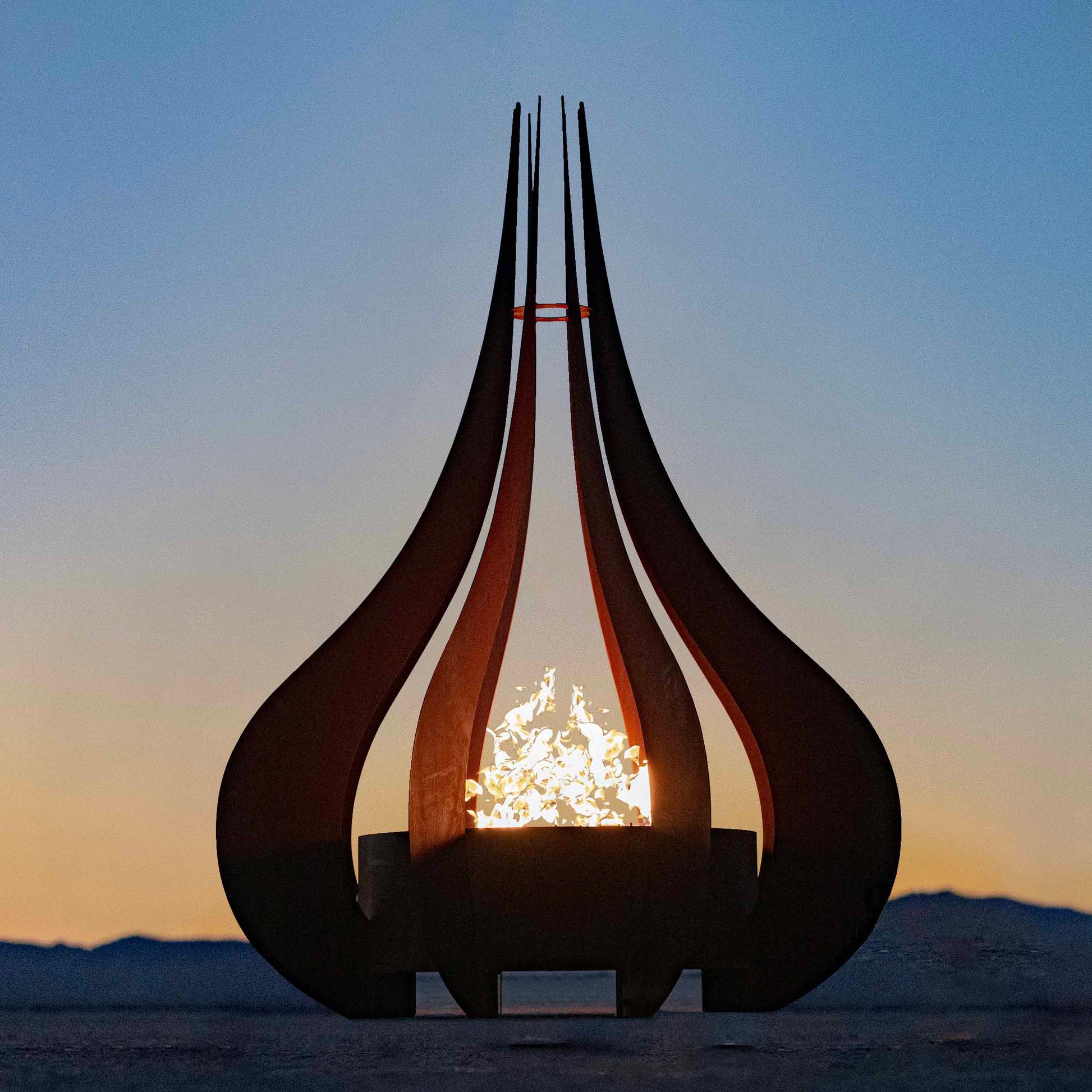 Gold-black Pinnacle fire sculpture matte steel with razor gold lip sleek modern fire sculpture
