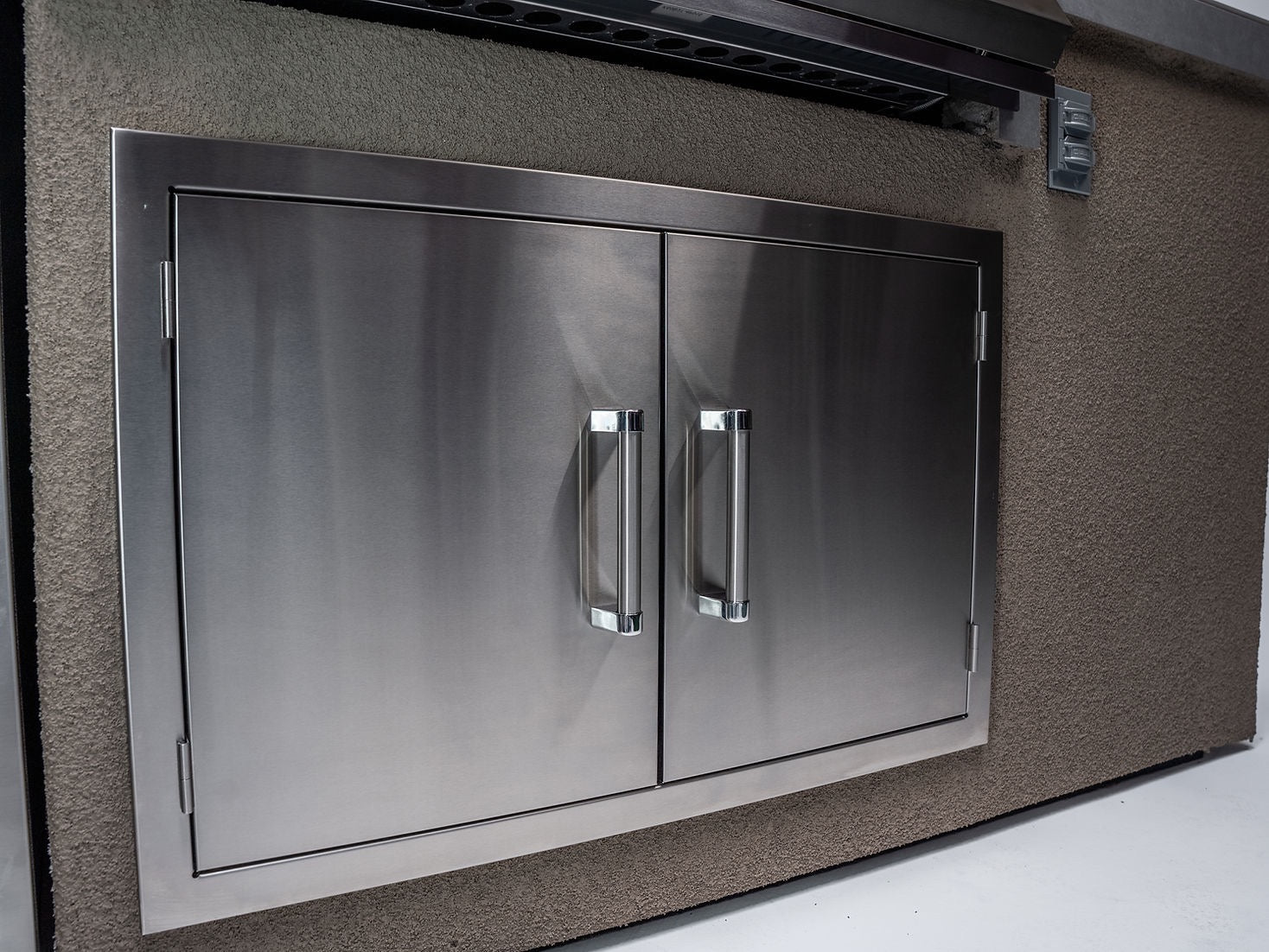 Gold-black Pinnacle outdoor kitchen built in stainless steel grill wine fridge luxury patio dining