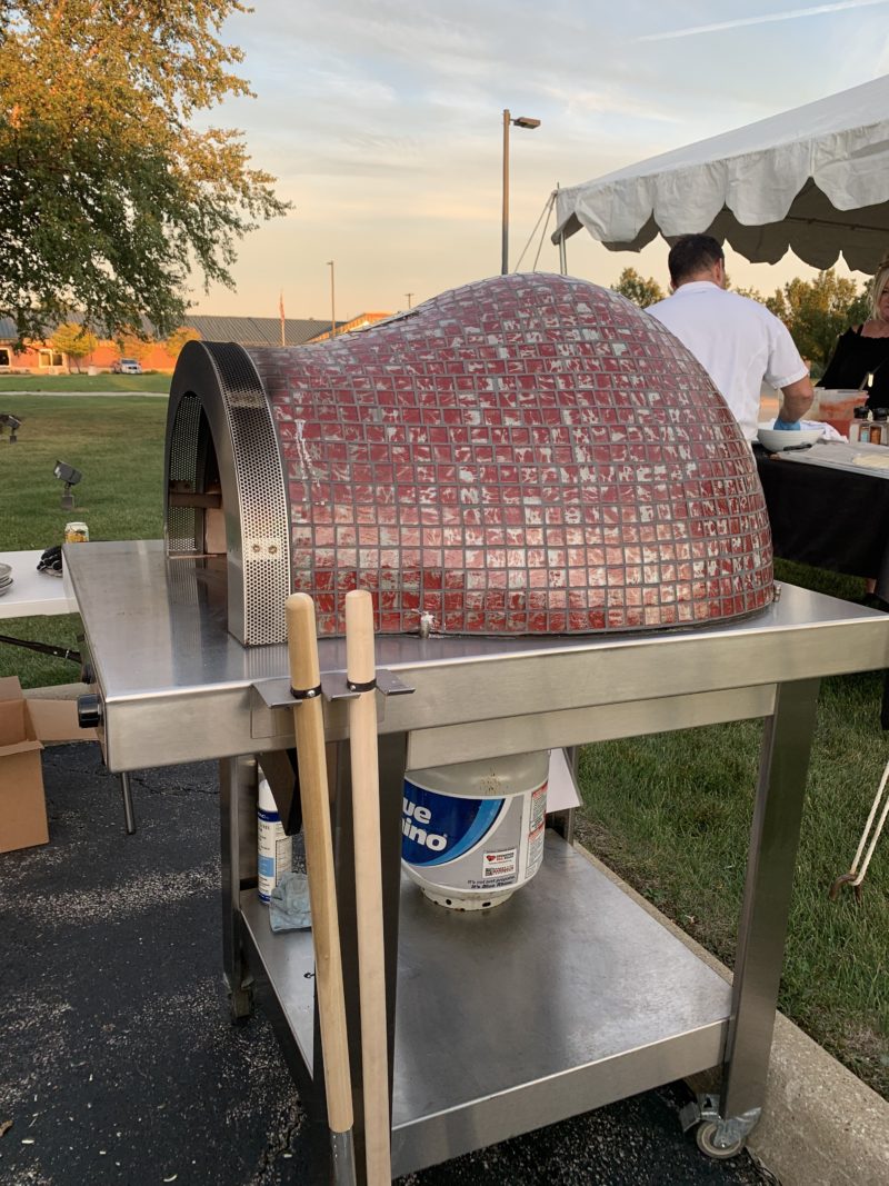 red mosaic glass oven on stainless hearth and black powder coated cart