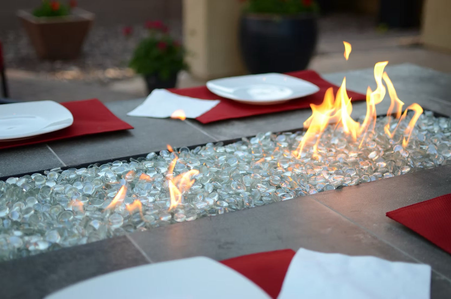 Kokomo Grills entertainer bar gas fire pit table with fire glass and active flames, luxury outdoor entertaining furniture for patios