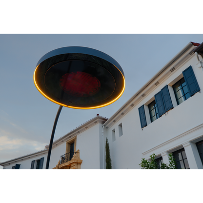 Close-up of the Bromic Eclipse Portable electric patio heater with glowing heating element and LED light