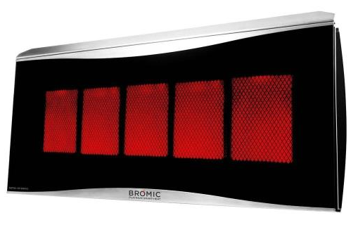 Bromic Platinum 500 Smart-Heat™ Natural Gas patio heater with ceramic glass front and stainless steel trim installed in a luxury outdoor living space.