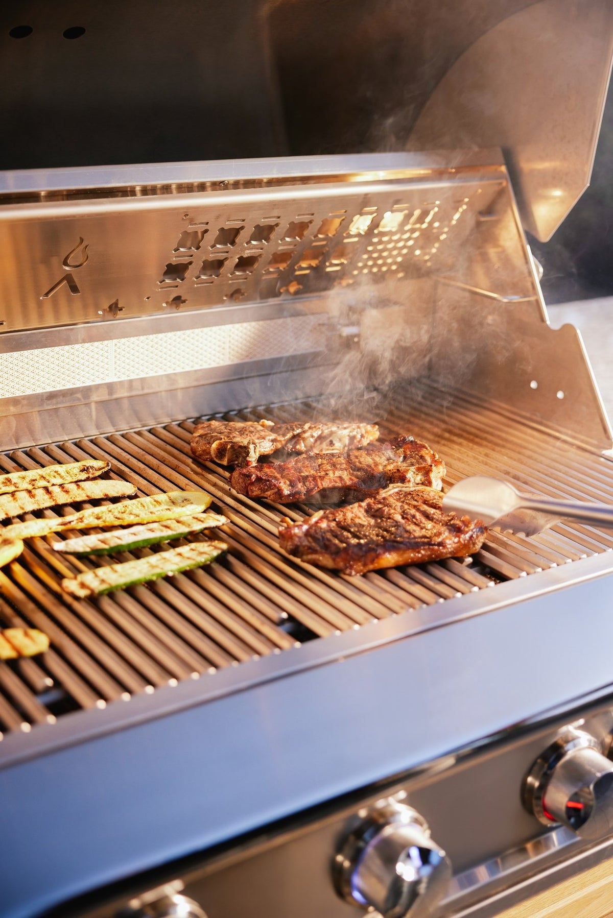 Blaze LTE PRO 40-Inch Gas Grill cooking steaks and vegetables