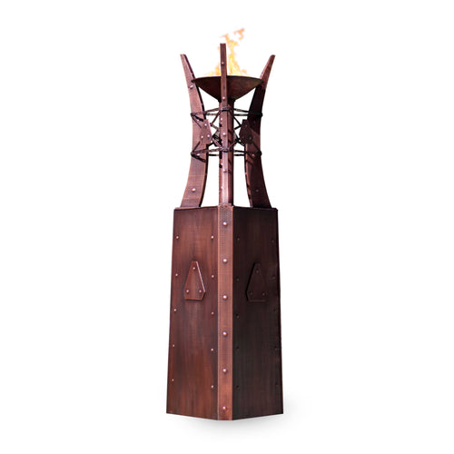 Bastille Fire Tower in hammered copper with lit flame, showing hand-finished details