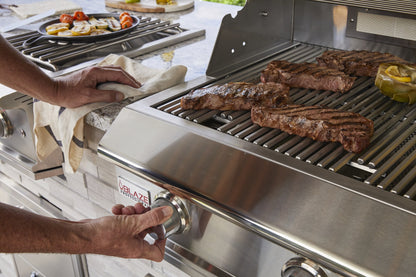 Blaze LUX 44-Inch grill cooking in a complete outdoor kitchen