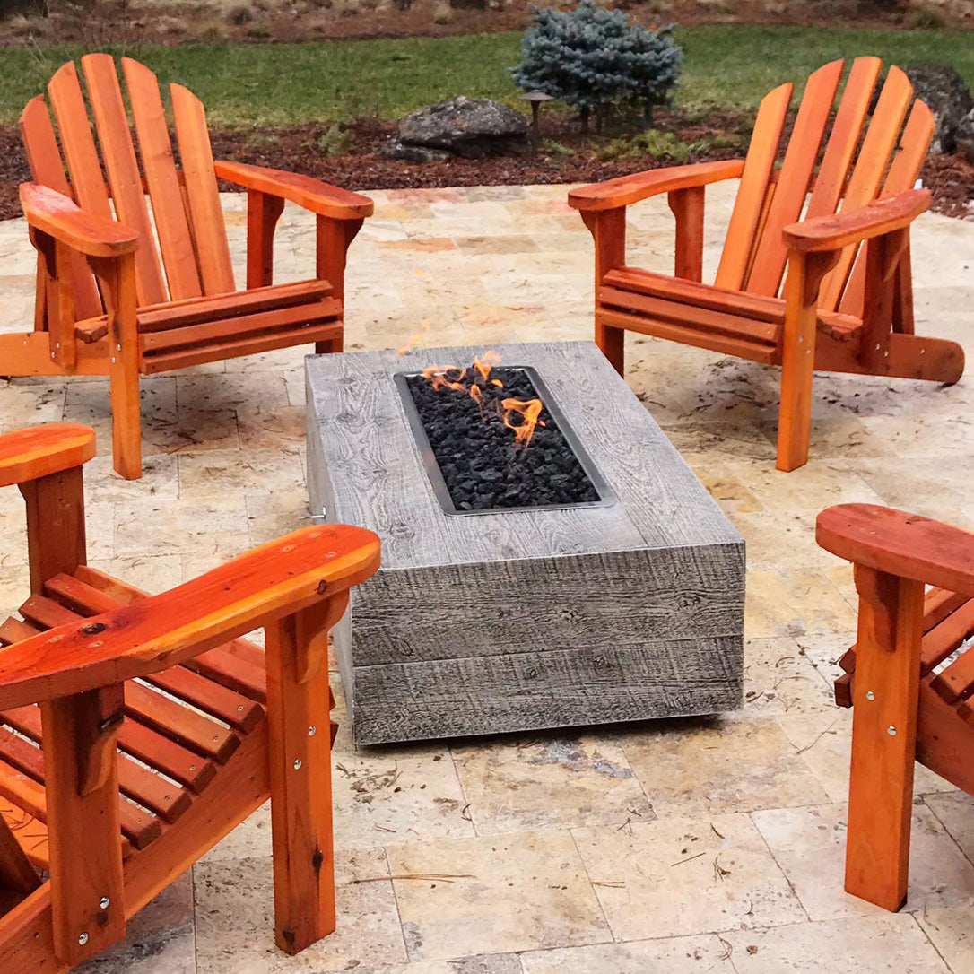 Gold-black Coronado Fire Pit in concrete with woodgrain finish
