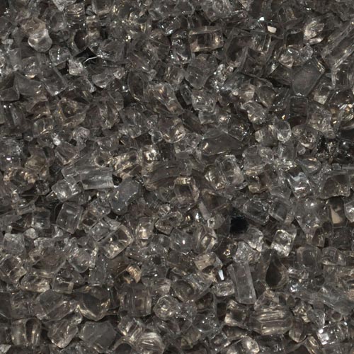 Bronze-colored fire pit glass chips for decorative outdoor fire features and fireplaces.