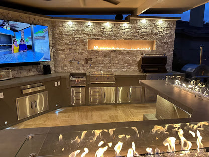 Gold-black Pinnacle outdoor kitchen built in stainless steel grill wine fridge luxury patio dining
