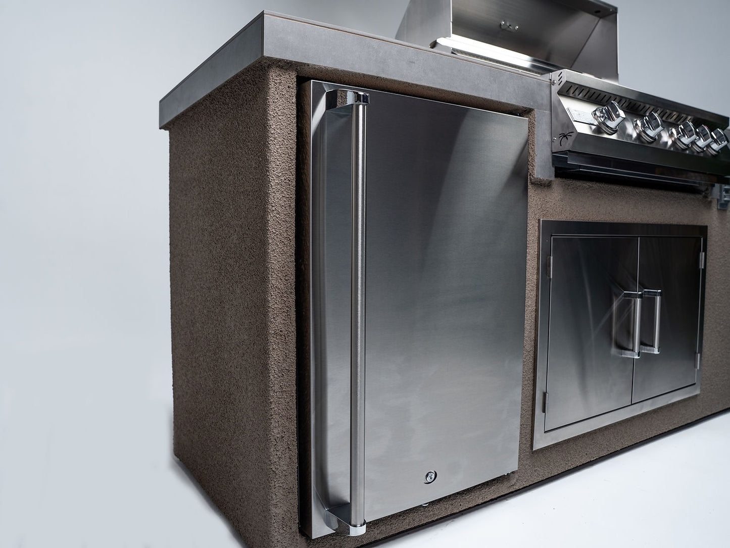 Gold-black Pinnacle outdoor kitchen built in stainless steel grill wine fridge luxury patio dining