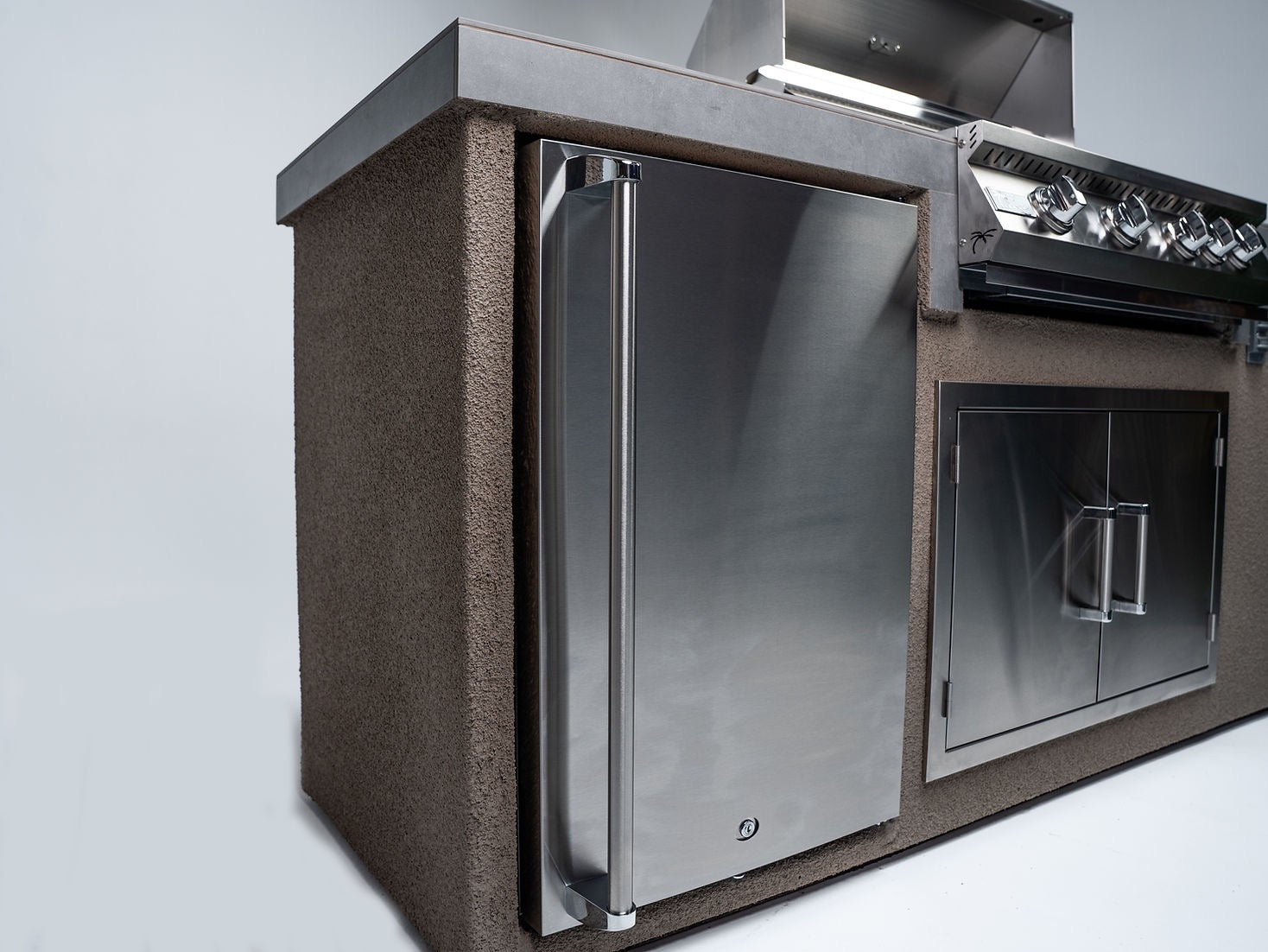 Gold-black Pinnacle outdoor kitchen built in stainless steel grill wine fridge luxury patio dining