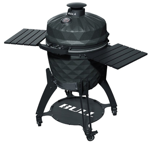 Bull 24-inch Complete Kamado Blackhorn Grill with cart shown closed, highlighting its premium ceramic body, integrated side shelves, storage shelf, and locking caster design.