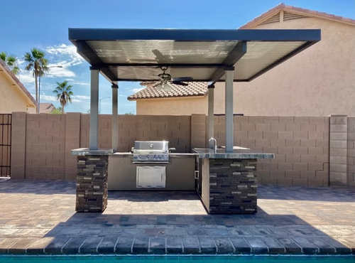 Gold-black Pinnacle outdoor kitchen built in stainless steel grill wine fridge luxury patio dining