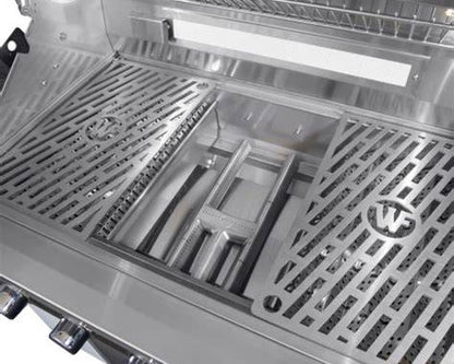 Wildfire Ranch PRO 36-inch grill interior showing stainless steel cooking grates lifted to reveal the burner and heat distribution system.