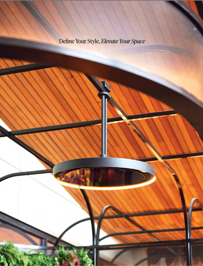 Suspended Bromic Eclipse patio heater mounted beneath a modern pergola ceiling with warm ambient outdoor lighting and contemporary architectural design.