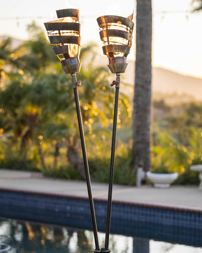 Corten steel Spiral Torch outdoor fire sculpture with flame at The Pinnacle Patio
