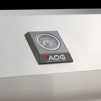 AOG built-in temperature gauge mounted on the stainless steel hood of an American Outdoor Grill.