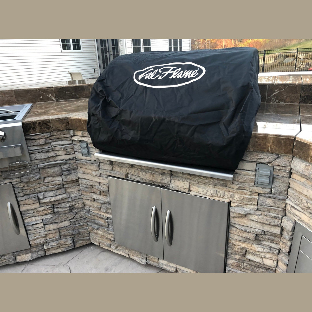 Cal Flame built-in P-Series grill cover installed on outdoor kitchen island