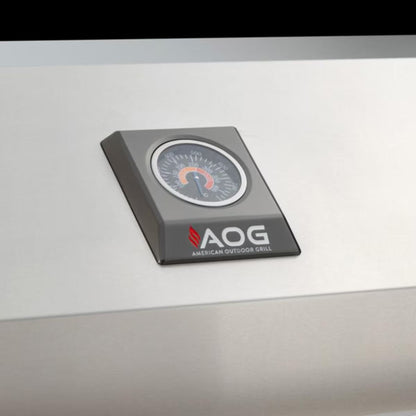 AOG built-in temperature gauge mounted on the stainless steel hood of an American Outdoor Grill.
