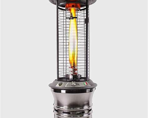 A stainless steel patio heater with a glowing orange and yellow flame inside a wire safety cage, set against a solid light gray background.