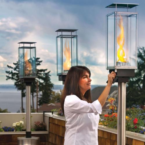 Tempest 20K outdoor gas torch with manual piezo ignition being operated on patio