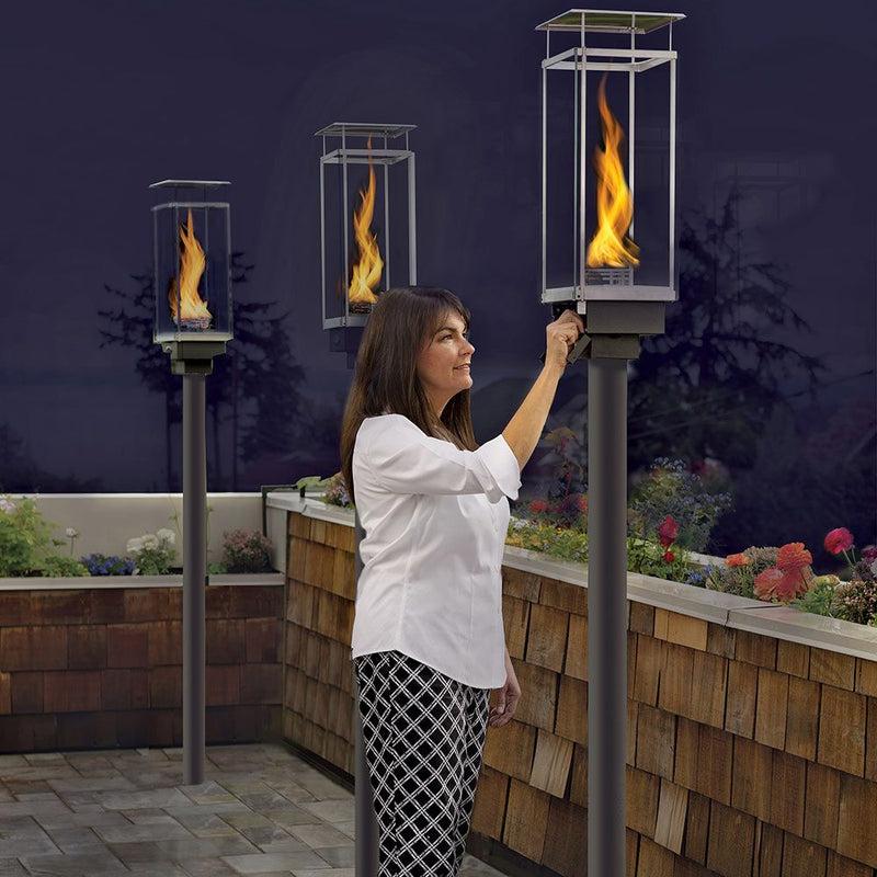 Tempest 20K manual gas torches installed around luxury outdoor patio