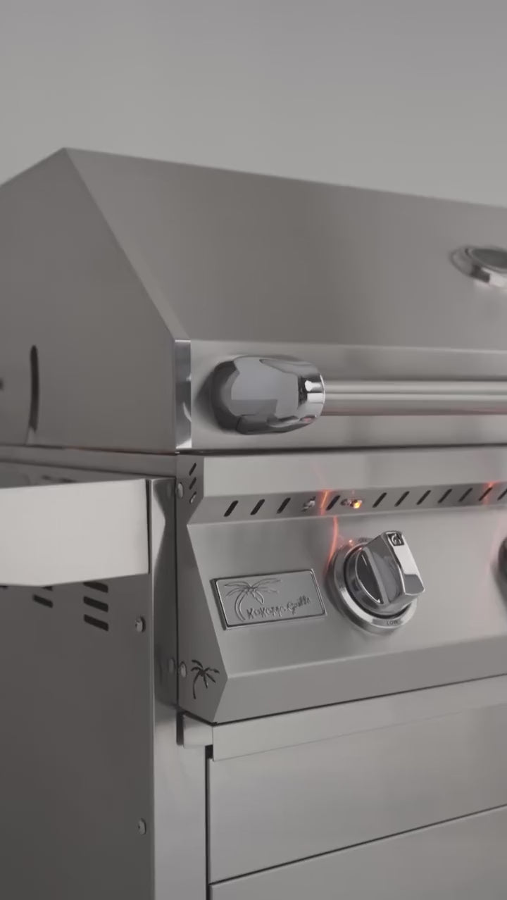 Video highlighting the Kokomo professional built-in gas grill with illuminated control knobs, polished stainless steel construction, and premium outdoor kitchen styling.