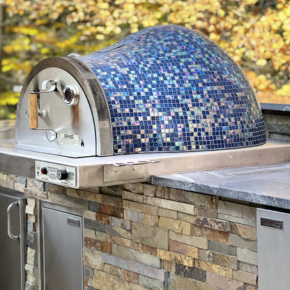 Villa Series Pizza Oven installed in a luxury outdoor kitchen, showing stainless steel flange and brick construction.