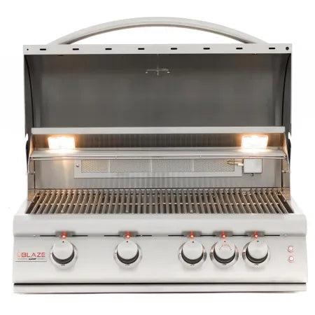Blaze LTE+ Marine Grade 32-Inch grill open showing stainless steel cooking grates and interior lights